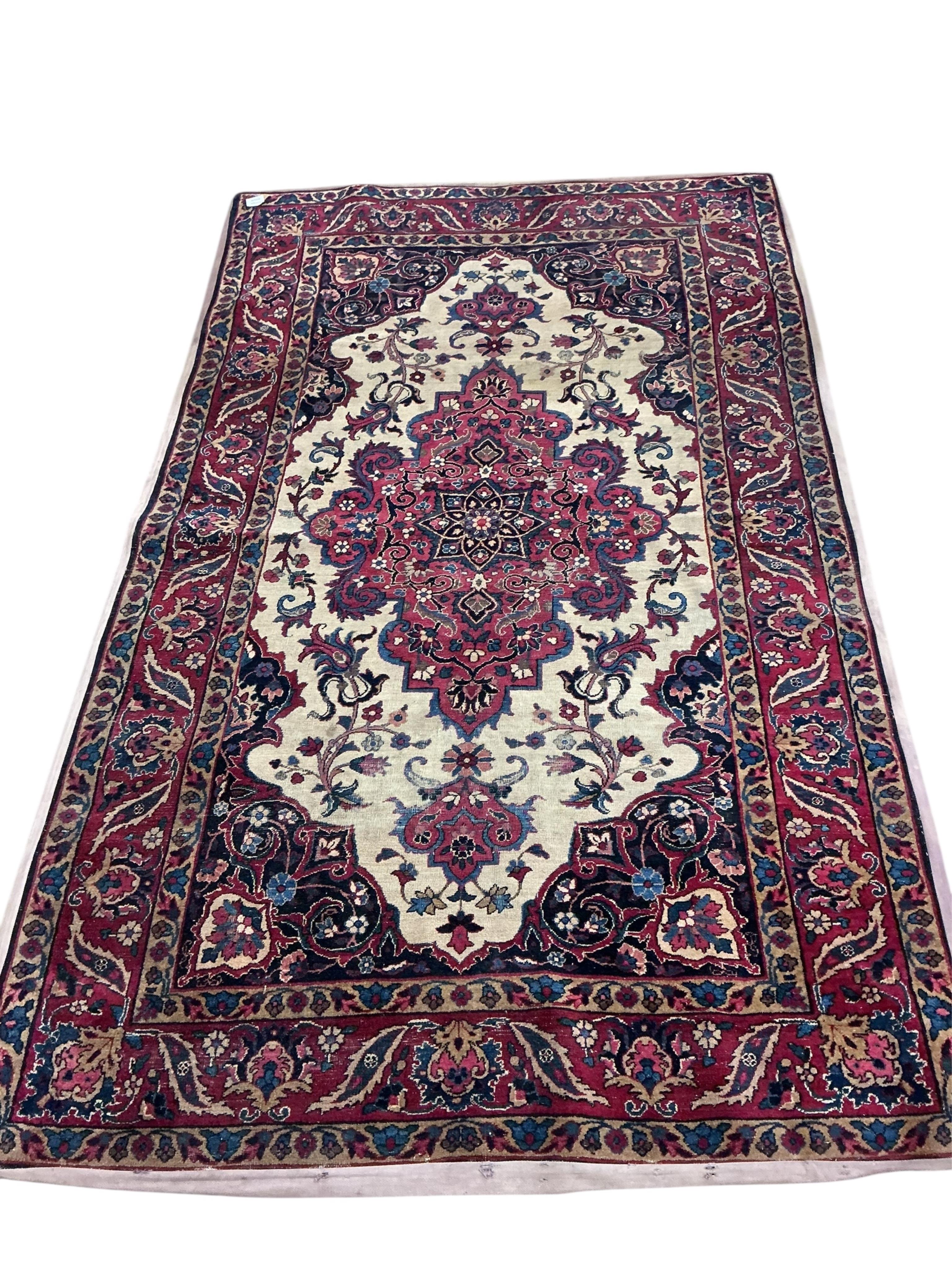 A Tabriz ivory ground rug, 208 x 125cm
